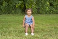 Adorable toddler girl sitting on a stool