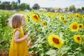 Adorable toddler girl on sunflower field Royalty Free Stock Photo