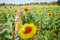 Adorable toddler girl on sunflower field Royalty Free Stock Photo