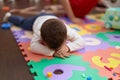 Adorable toddler lying on floor crying at kindergarten Royalty Free Stock Photo