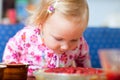 Adorable toddler with strawberry pie Royalty Free Stock Photo