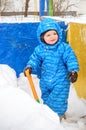 Adorable tree year old boy shoveling snow Royalty Free Stock Photo