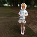 An adorable vintage TAKARA doll is standing alone at a lonely road. She`s waiting for someone who will pass by and pick her up