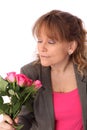 Adorable woman holding pink roses Royalty Free Stock Photo