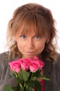 Adorable woman holding pink roses Royalty Free Stock Photo