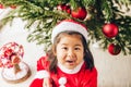 Adorable 3 year old toddler girl enjoying Christmas time Royalty Free Stock Photo