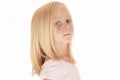 Adorable young blonde girl in pink top glancing ba Royalty Free Stock Photo