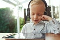 Adorable young boy listening to music Royalty Free Stock Photo