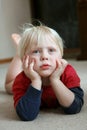 Adorable Young Child Laying on Living Room Floor