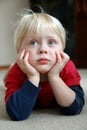 Adorable Young Child Laying on Living Room Floor Royalty Free Stock Photo