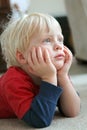 Adorable Young Child Laying on Living Room Floor Royalty Free Stock Photo