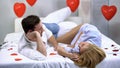 Adorable young couple lying on bed and enjoying time together, romantic moments Royalty Free Stock Photo