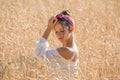 Adorable young girl on golden wheat field Royalty Free Stock Photo