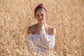 Adorable young girl on golden wheat field Royalty Free Stock Photo