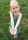 Adorable young girl holding grasshopper Royalty Free Stock Photo
