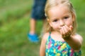 Adorable young girl holding grasshopper Royalty Free Stock Photo