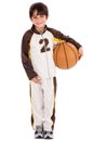 Adorable young kid in his sports dress with ball