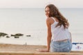 adorable young woman on the beach in the rays of the rising sun Royalty Free Stock Photo