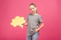 adorable youngster holding yellow thought bubble, isolated