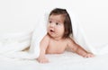 Adorably baby lie on white towel in bed. Happy childhood and healthcare concept Royalty Free Stock Photo