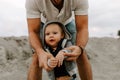 Adorably Perfect Young Father and Baby Toddler Son Family Having Fun Time at the Sandy Beach During Sunset Outside By the Ocean Wa Royalty Free Stock Photo