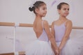 Two little ballerinas talking after dancing lesson Royalty Free Stock Photo