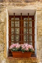 Adorned windows in the medieval streets of San Gimignano Royalty Free Stock Photo