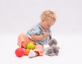 Adorsble baby girl plays with toys Royalty Free Stock Photo