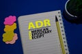 ADR - American Depositary Receipt acronym write on a book isolated on Office Desk