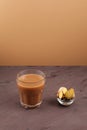 Adrak chai - Indian ginger tea or masala tea on brown background with copy space. Selective focus Royalty Free Stock Photo