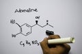 Adrenaline C9,H13,NO3 molecule written on the white board. Structural chemical formula. Education concept