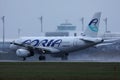 Adria Airways plane taxiing on runway