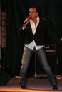 Adrian Enache singing in front of the spectators, on a stage. Royalty Free Stock Photo