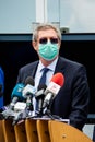 Adrian Streinu Cercel. Doctor wearing mask at a press conference. Royalty Free Stock Photo