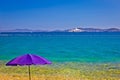 Adriatic beach in Zadar with megayacht background Royalty Free Stock Photo