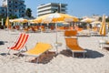 Adriatic Sea coast view. Seashore of Italy, summer umbrellas on sandy beach with clouds on horizon. Royalty Free Stock Photo