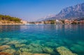 Adriatic sea shore with small leisure boats inside the harbor of Makarska City