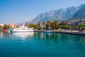 Adriatic sea shore with small leisure boats inside the harbor of Makarska City