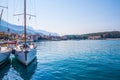 Adriatic sea shore with small leisure boats inside the harbor of Makarska City