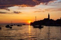 Adriatic sea with some boats sailing and the view of the croatian houses of Rovinj, Croatia, and the bell tower of the Church of Royalty Free Stock Photo