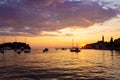 Adriatic sea with some boats sailing and the view of the croatian houses of Rovinj, Croatia, and the bell tower of the Church of Royalty Free Stock Photo