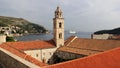 Adriatic Sea view of the over the red tiled roofs, Dominican monastery bell-tower in the forefront, Dubrovnik, Croatia Royalty Free Stock Photo