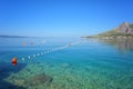 Adriatic seacoast, beach with clear water of the sea and blue sky, Omis, Croatia, Dalmatia. Outdoor travel background Royalty Free Stock Photo