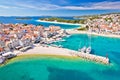 Adriatic tourist town of Primosten turquoise beach and seafront aerial view