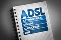 ADSL - Asymmetrical Digital Subscriber Line acronym on notepad, technology concept background