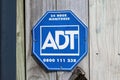 ADT Home Security 24 hour monitored sign on fence