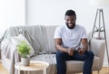 Adult african man playing video games at home Royalty Free Stock Photo