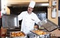 Arab chef with food at restaurant hotel