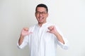 Adult Asian man showing enthusiastic expression while pointing to his self Royalty Free Stock Photo