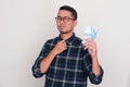 Adult Asian man showing off his money Royalty Free Stock Photo